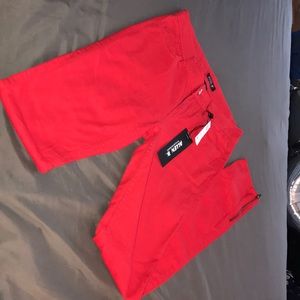 red jeans with zip bottoms